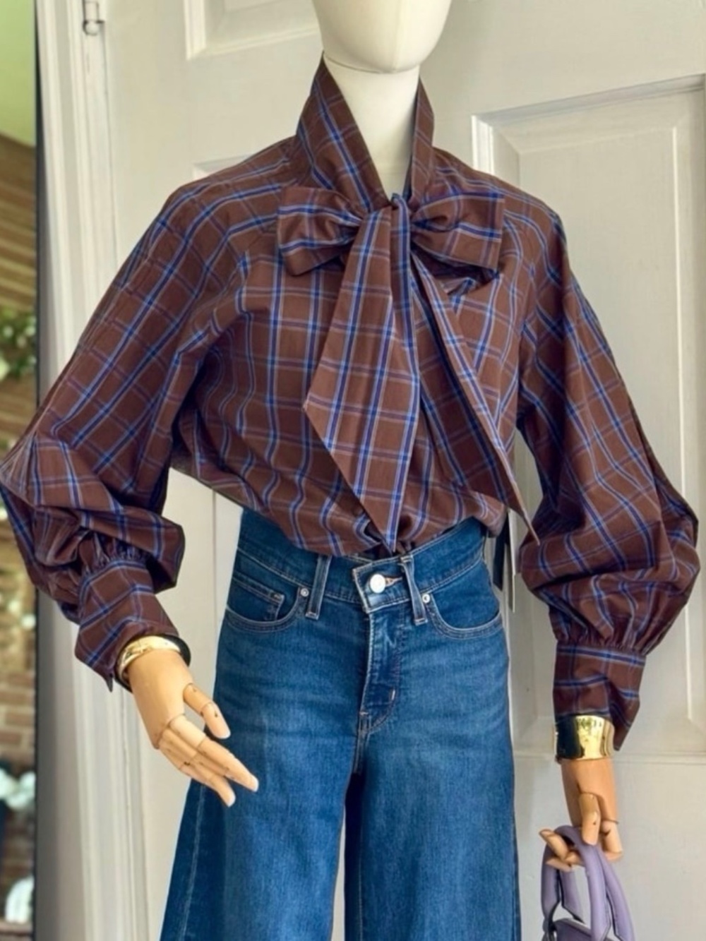 Plaid shirt with bow tie.